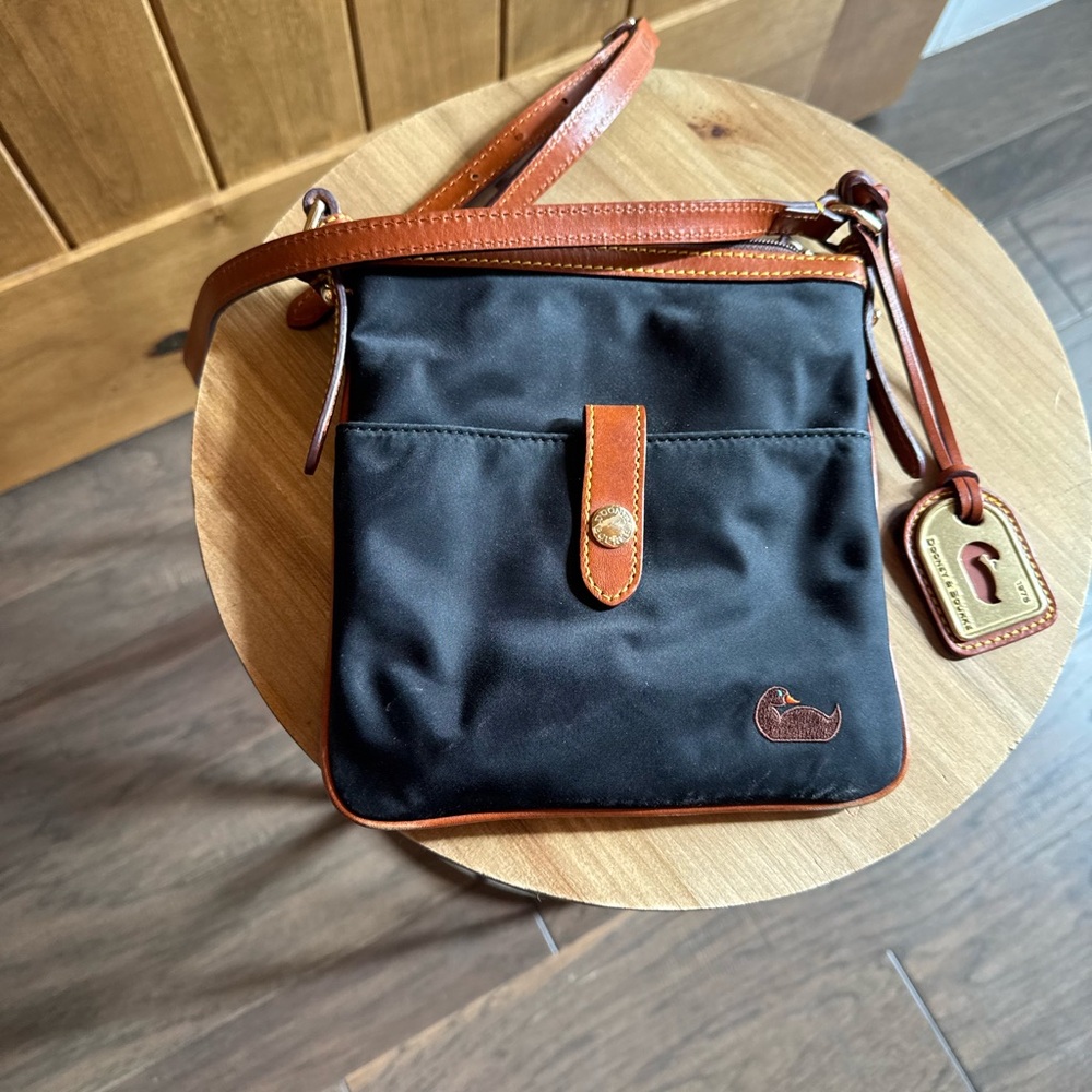 Tiny Dooney and Bourke Crossbody bag black with tan leather